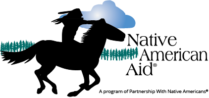 Logo for the Native American Aid that shows a silhouette of a Native American warrior holding a spear with mountains and pine trees in the background, symbolizing strength and heritage under a blue sky.